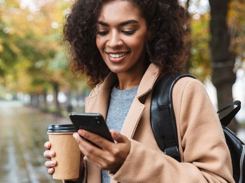 Woman paying mortgage on her phone